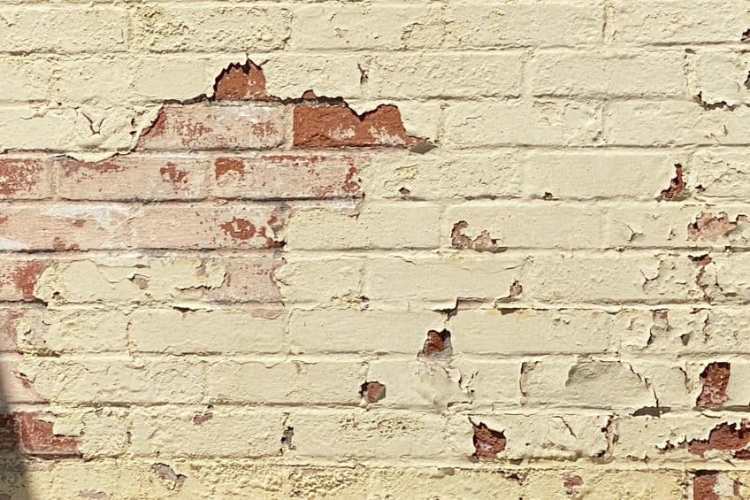 Damaged Paint on Brick Exterior